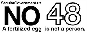 A sign says SecularGovernment.us, No 48, A fertilized egg is not a person.