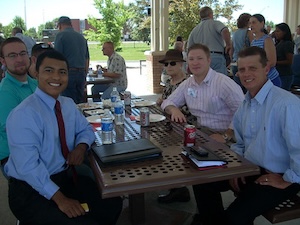 Seated at a table: Mike Morison, Adam Eidelberg, Andrew Goad, and Brian Cambell.