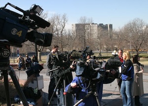 TV media personnel gather near the Colorado capitol.