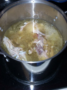 Turkey stock cooking on the stove.