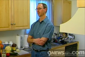 A screen capture of the author in his kitchen, with food on the counter, and the 9News logo.