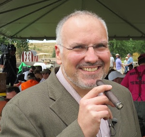 David Martosko holding a cigar.