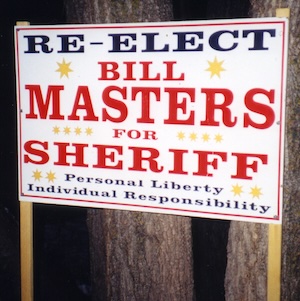 A sign says Re-Elect Bill Masters for Sheriff, Personal Liberty, Individual Responsibility.