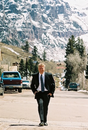 Bill Masters, wearing a suit, walking down the streets of Telluride.