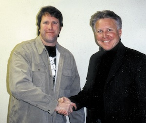 Gregg Stone shaking hands with Bill Masters.